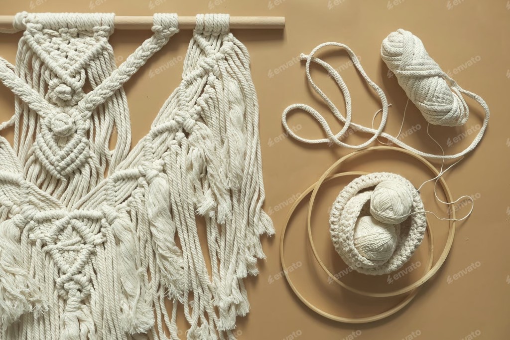 Macramé wall hanging with cotton cord, embroidery hoops, and yarn
